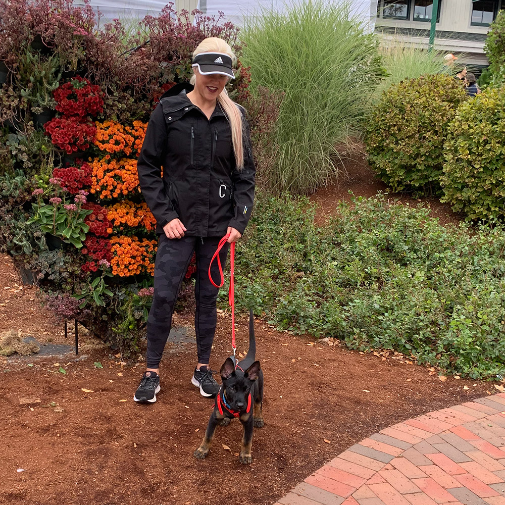 Rozalynn Parkhurst, Board & Train Programs Trainer at MDTC - walking a puppy